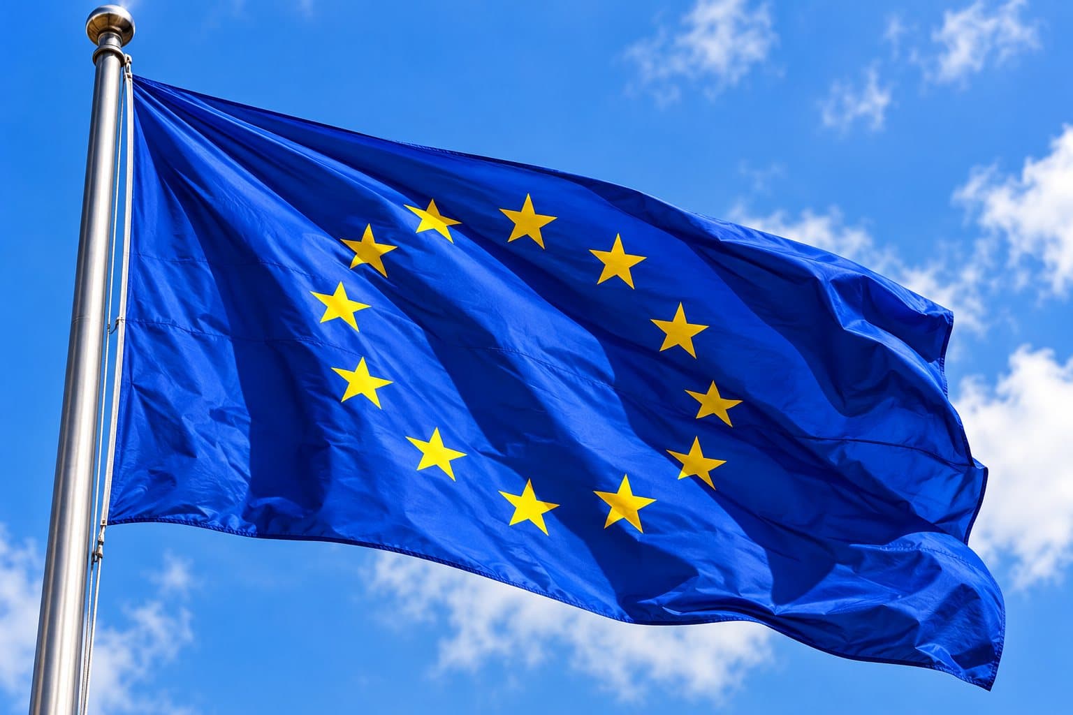 European Union flag waving against a blue sky