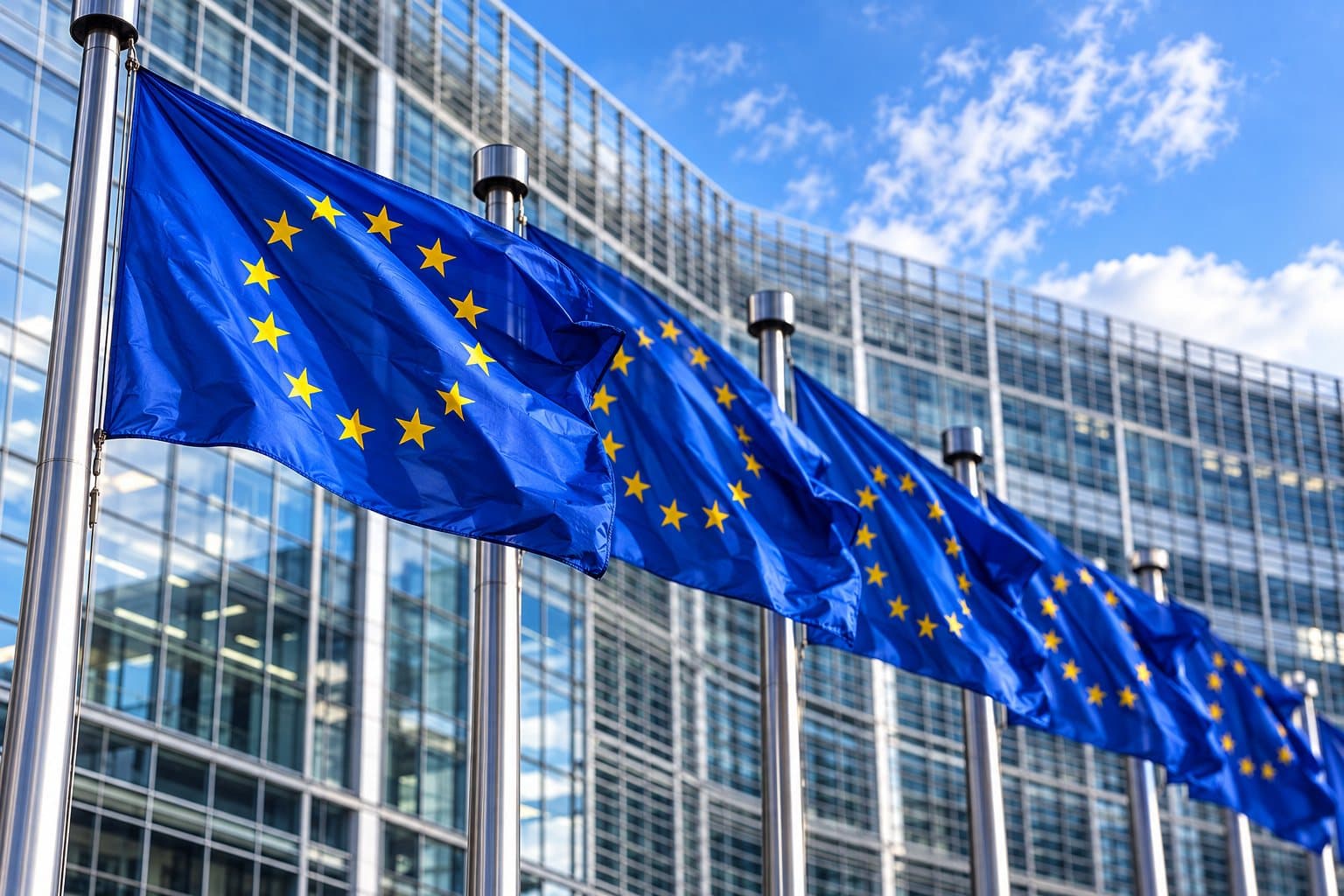 European Union flags in front of a modern office building